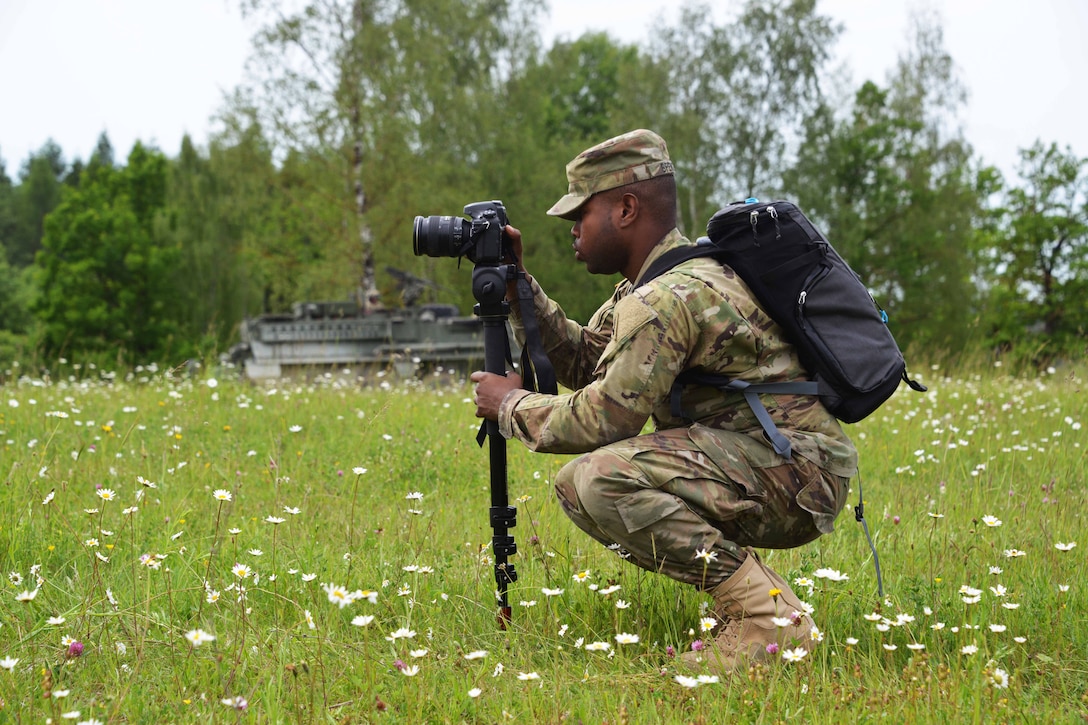 Army Spc. Javon Spence assigned to the Training Support Center Grafenwoehr, Training Support Activity Europe, documents the 2nd Cavalry Regiment’s demonstration of a Wet Gap Crossing in preparation for Exercise Saber Guardian 17 in Grafenwoehr, Germany, June 8, 2017. Army photo by Gertrud Zach
