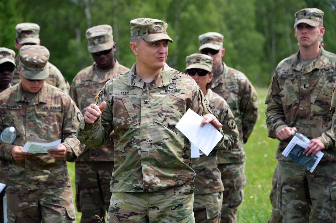 Army Col. Patrick J. Ellis, commander of the 2nd Cavalry Regiment, center, talks about the concept of a Wet Gap Crossing in preparation for Exercise Saber Guardian 17 in Grafenwoehr, Germany, June 8, 2017. Exercise Saber Guardian 17 is a U.S. European Command, U.S. Army Europe-led annual exercise taking place in Hungary, Romania and Bulgaria in the summer of 2017. This exercise involves more than 25,000 service members from over 20 ally and partner nations. The largest of the Black Sea Region exercises, Saber Guardian 17 is a premier training event for U.S. Army Europe and participating nations that will build readiness and improve interoperability under a unified command, executing a full range of military missions to support the security and stability of the Black Sea Region. Army photo by Gertrud Zach