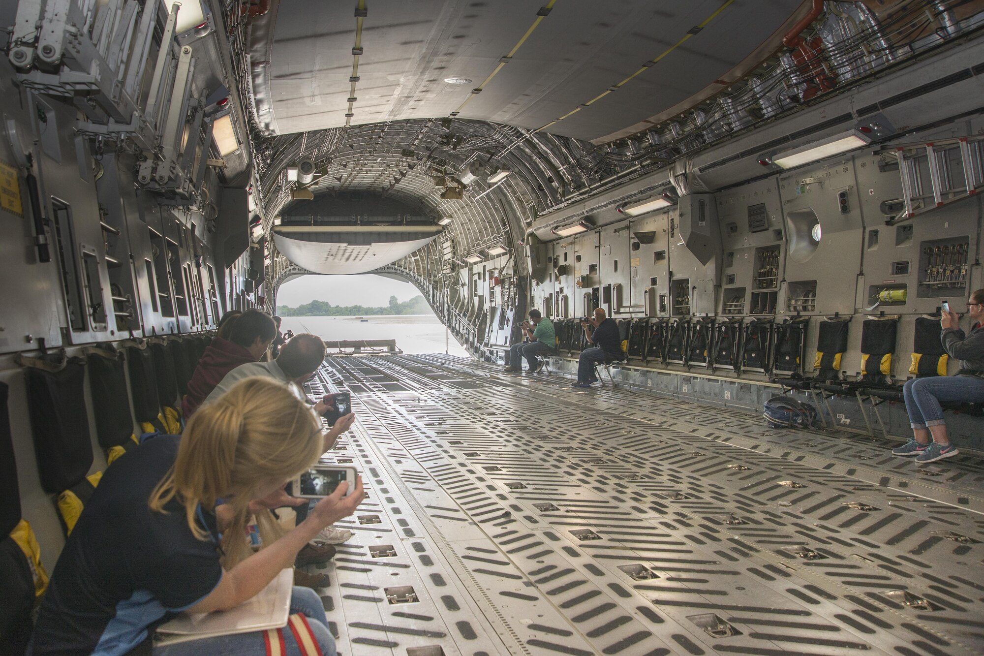 Members of the Leadership Central Delaware program observe a combat offload June 13, 2017, on Dover Air Force Base, Del. The program is designed to prepare the leaders of tomorrow with the information, knowledge and resources to better their living area and work area. (U.S. Air Force photo by Staff Sgt. Jared Duhon)