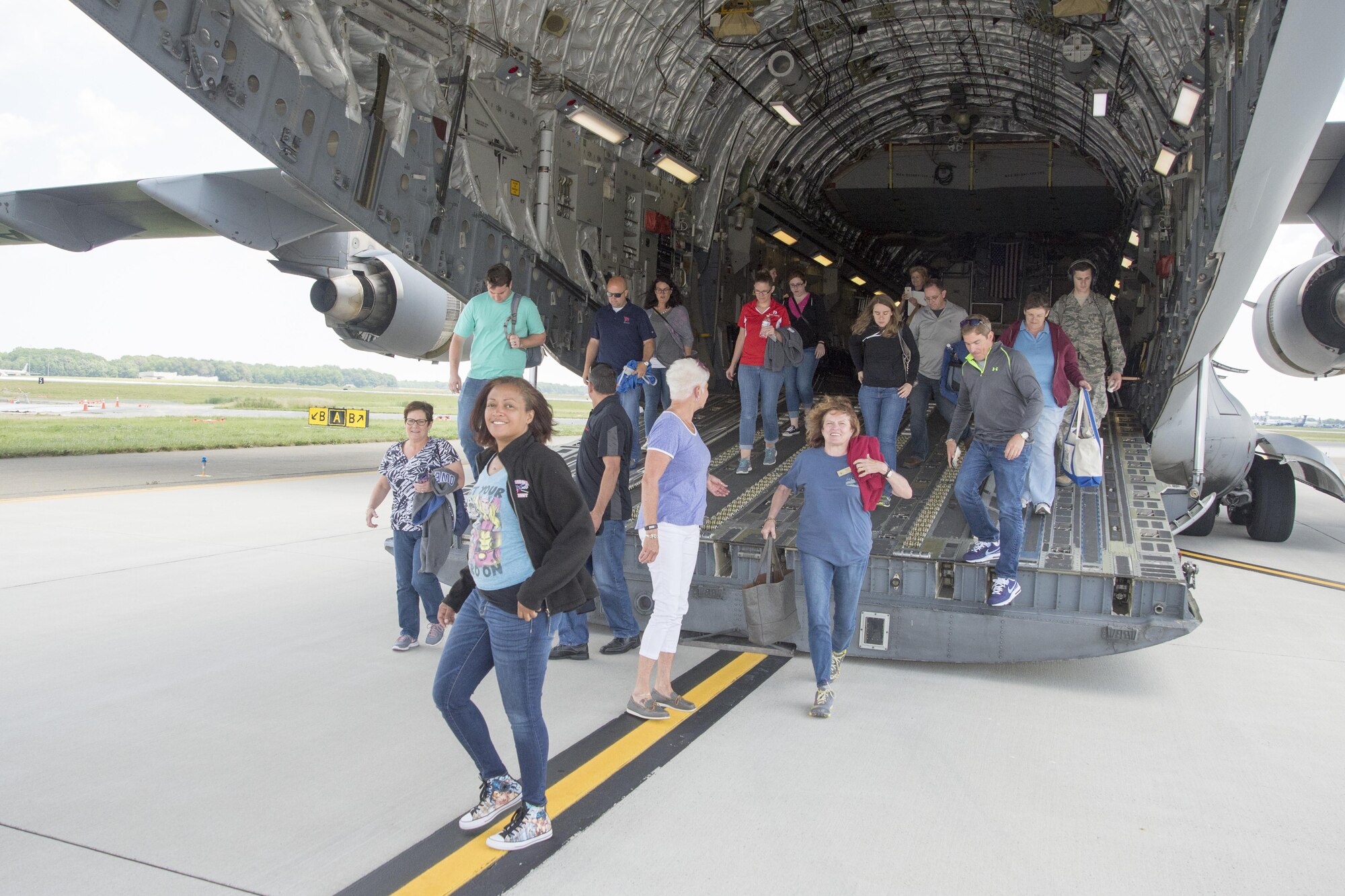 Members of the Leadership Central Delaware program depart a C-17 Globemaster III June 13, 2017, on Dover Air Force Base, Del. The program is designed to cultivate individuals who desire stronger leadership skills and have the drive to help their community. (U.S. Air Force photo by Staff Sgt. Jared Duhon)