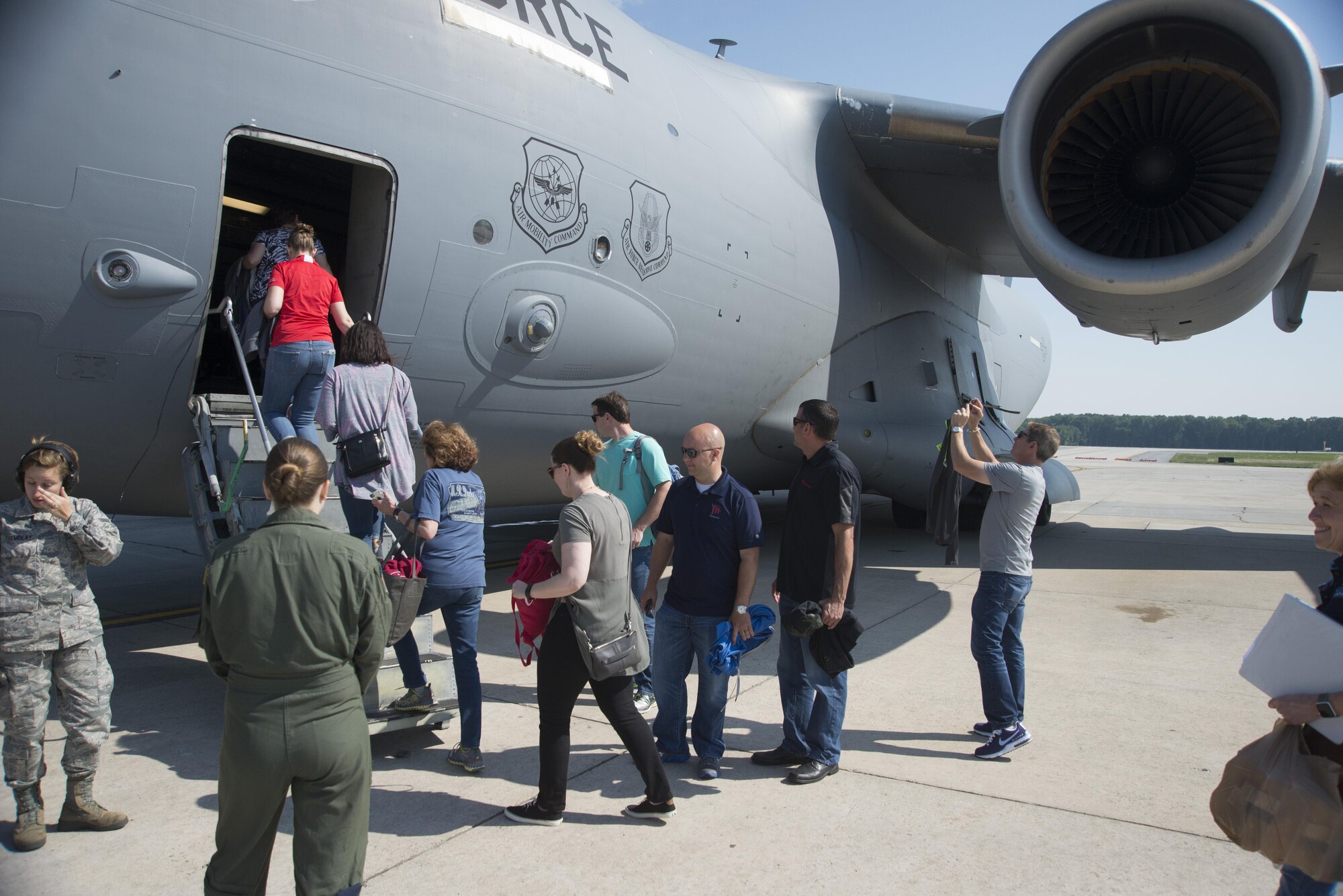 Members of the Leadership Central Delaware program board a C-17 Globemaster III June 13, 2017, on Dover Air Force Base, Del. The program is 10 months long and explores economic drivers such as tourism, energy and the environment, and healthcare. (U.S. Air Force photo by Staff Sgt. Jared Duhon)