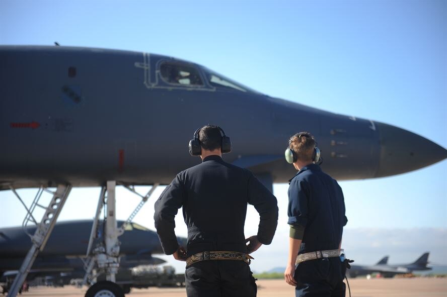 U.S. Air Force Senior Airman Robert Shedd (left), and Staff Sgt. Robert Gallagher, both 7th Aircraft Maintenance Squadron B-1B Lancer crew chiefs, prepare to marshal a B-1 during Exercise Constant Vigilance 16, April 10, 2016, at Dyess Air Force Base, Texas. Training and exercise participation of all Airmen is critical to Air Force Global Strike Command's ability to respond quickly and effectively to real-world situations. (U.S. Air Force photo by Airman 1st Class Rebecca Van Syoc)