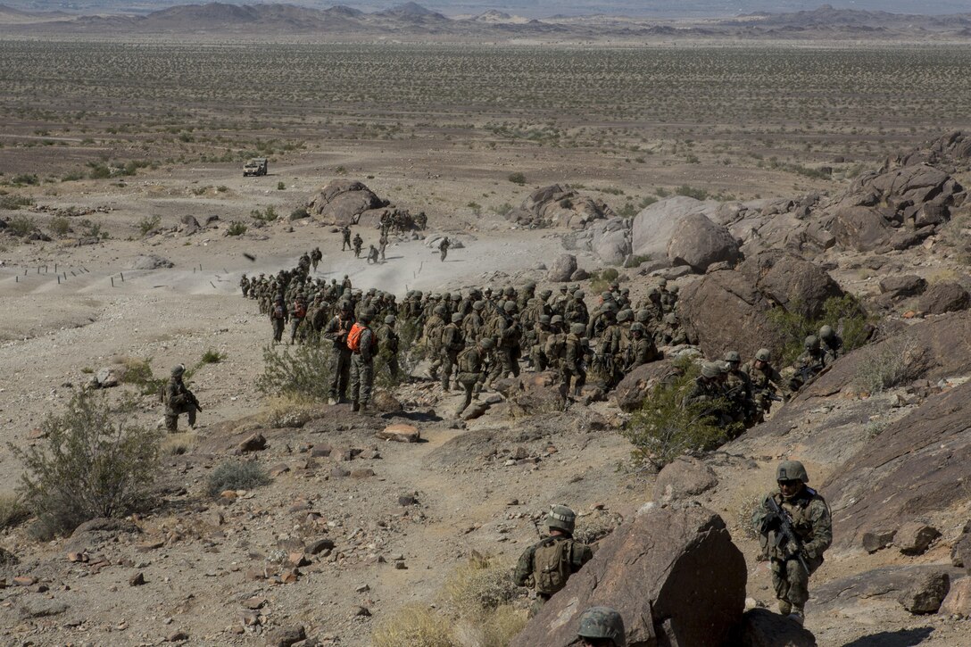 U.S. Marines with Golf Company, 2nd Battalion, 25th Marines, 4th Marine Division, Marine Forces Reserve move to machine gun hill on range 400 as part of Integrated Training Exercise 4-17 at Camp Wilson, Twentynine Palms, California on June 18, 2017. ITX 4-17 is a live-fire and maneuver combined arms exercise designed to train battalion and squadron-sized units in the tactics, techniques, and procedures required to provide a sustainable and ready operational reserve for employment across the full spectrum of crisis and global engagement.