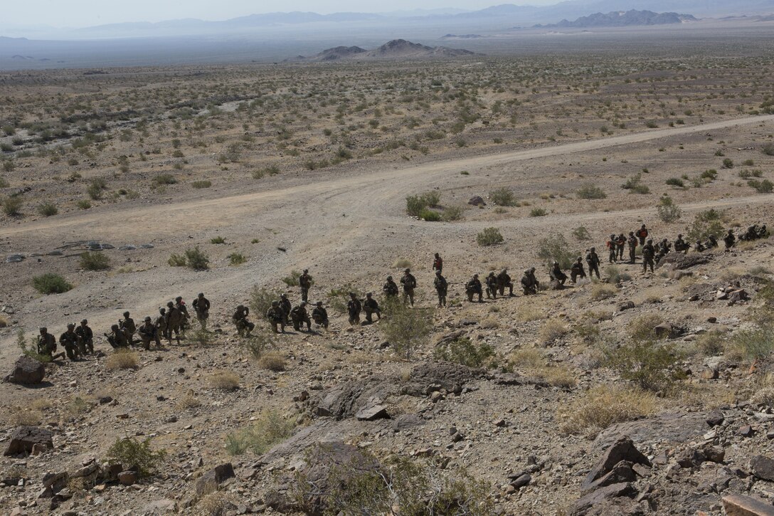 U.S. Marines with Golf Company, 2nd Battalion, 25th Marines, 4th Marine Division, Marine Forces Reserve, prepare to move on range 400 during Integrated Training Exercise 4-17 at Camp Wilson, Twentynine Palms, California on June 18, 2017. ITX is the largest annual Marine Forces Reserve training exercise, bringing together over 5,000 Marines from across the United States to prepare battalion and squadron-sized units for combat, under the most realistic conditions possible.