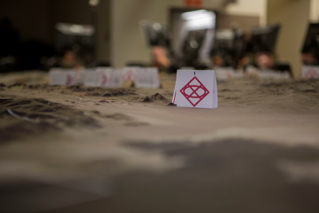 A training area terrain model is located center room at the Tactical Training Control Exercise Group Battle Simulation Center on June 19th, 2017, as U.S. Marines with 2nd battalion, 25 Marines, 4th Marine Division, Marine Forces Reserve, prepare for the final training sequence of Integrated Training Exercise 4-17, Marine Corps Air Ground Combat Center Twentynine Palms, California. ITX 4-17 is a live-fire and maneuver combined arms exercise designed to train battalion and squadron-sized units in the tactics, techniques, and procedures required to provide a sustainable and ready operational reserve for employment across the full spectrum of crisis and global engagement. (U.S. Marine Corps photo by Lance Cpl. Imari J. Dubose)