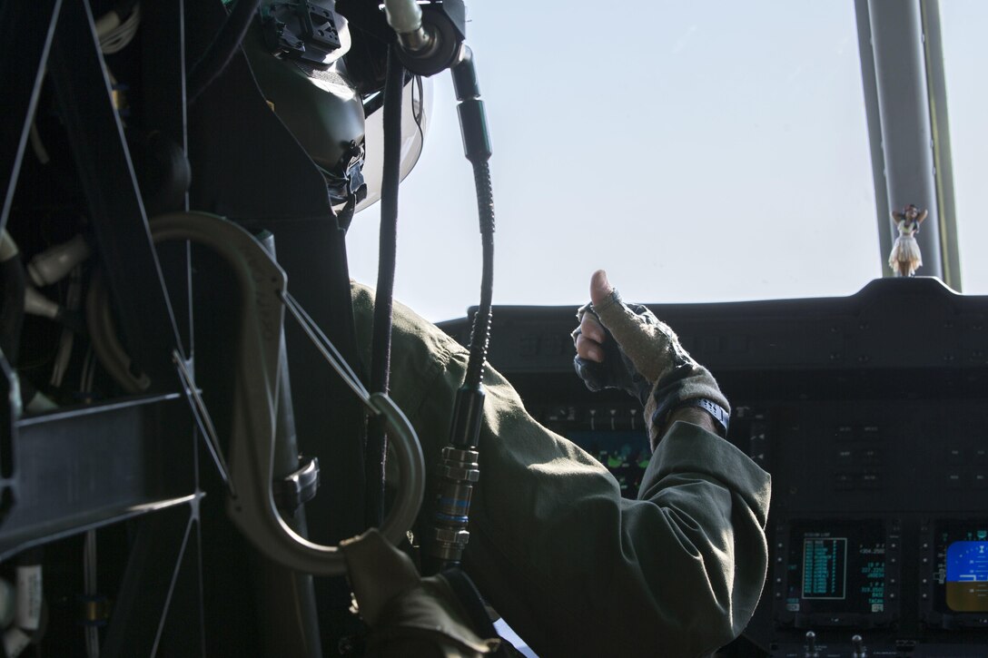 U.S. Marine Corps Maj. Jacob Schwam, a pilot with Marine Light Attack Helicopter Squadron 773, Marine Aircraft Group 49, 4th Marine Aircraft Wing, Marine Forces Reserve, gives the thumbs up for the UH-1Y Huey to take-off for a battlefield survey with Col. Thomas E. Prentice, commanding officer, 23rd Marine Regiment, 4th Marine Division, MARFORRES, at Marine Air Ground Combat Center Twentynine Palms, California during Integrated Training Exercise 4-17, June 20, 2017. The scouting mission was in preparation of the 25th Marine Regiment final battalion exercise during ITX 4-17. (U.S. Marine Corps photo by Imari J. Dubose)