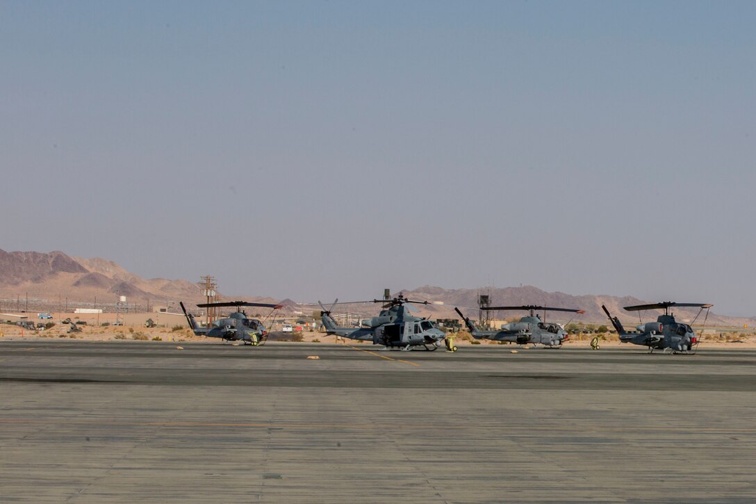 Four UH-1Y Huey’s belonging to Marine Light Attack Helicopter Squadron 773, Marine Aircraft Group 49, 4th Marine Aircraft Wing, Marine Forces Reserve, sit on the flightline at Marine Air Ground Combat Center Twentynine Palms, California during Integrated Training Exercise 4-17, June 20, 2017. ITX 4-17 is a live-fire and maneuver combined arms exercise designed to train battalion and squadron-sized units in the tactics, techniques, and procedures required to provide a sustainable and ready operational reserve for employment across the full spectrum of crisis and global engagement. (U.S. Marine Corps photo by Lance Cpl. Imari J. Dubose)