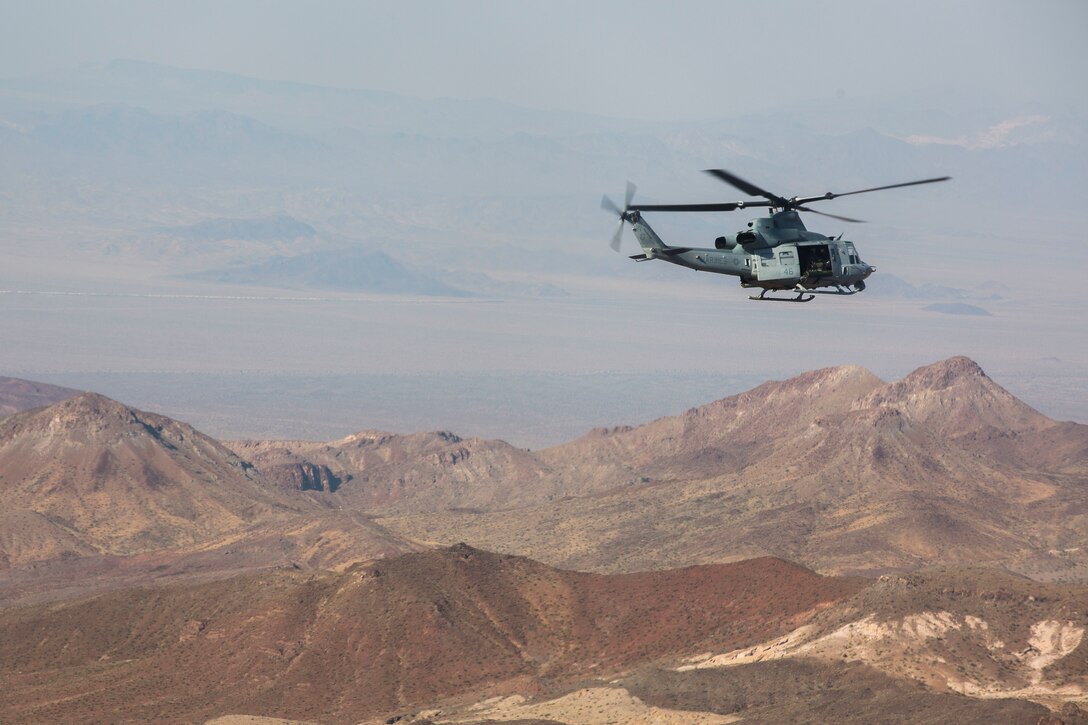 U.S. Marine Corps Col. Thomas E. Prentice, commanding officer, 23rd Marine Regiment, 4th Marine Division, Marine Forces Reserve, conduct reconnaissance of the training area at Marine Air Ground Combat Center Twentynine Palms, California during Integrated Training Exercise 4-17 on a UH-1Y Huey belonging to Marine Light Attack Helicopter Squadron 773, Marine Aircraft Group 49, 4th Marine Aircraft Wing, MARFORRES, June 20, 2017. The scouting mission was in preparation of the 25th Marine Regiment final battalion exercise during ITX 4-17. (U.S. Marine Corps photo by Imari J. Dubose)
