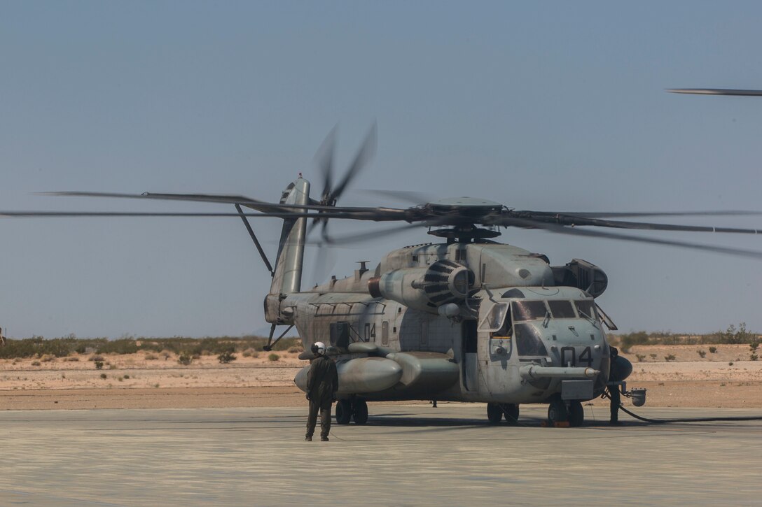 U.S. Marines with Marine Heavy Helicopter Squadron 772, Marine Aircraft Group 49, 4th Marine Aircraft Wing, Marine Forces Reserve, refuel A CH-53E Super Stallion on an airstrip at Camp Wilson, Marine Air Ground Combat Center Twentynine Palms, California, June 21, 2017 in preparation for night missions in support of the 2nd Battalion, 25th Marine Regiment, 4th Marine Division, MARFORRES, final battalion exercise of Integrated Training Exercise 4-17.  ITX 4-17 is a live-fire and maneuver combined arms exercise designed to train battalion and squadron-sized units in the tactics, techniques, and procedures required to provide a sustainable and ready operational reserve for employment across the full spectrum of crisis and global engagement. (U.S. Marine Corps photo by Imari J. Dubose)