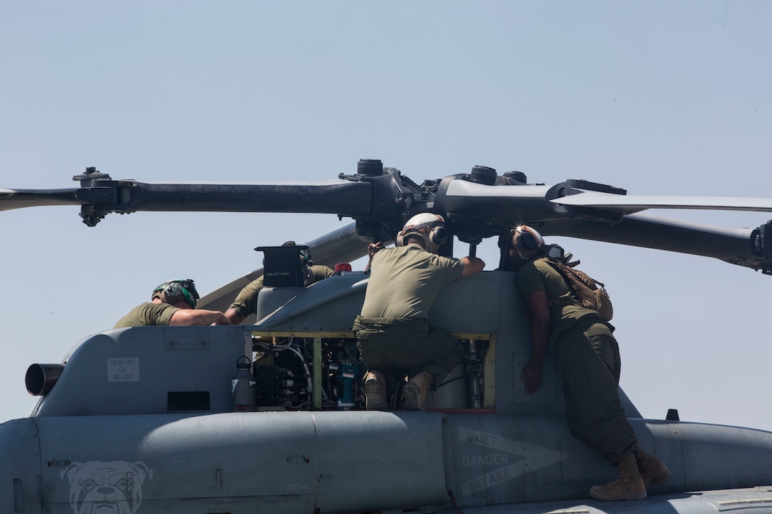 U.S. Marines with Marine Light Attack Helicopter Squadron 773, Marine Aircraft Group 49, 4th Marine Aircraft Wing, Marine Forces Reserve, conduct maintenance on an AH-1Z Cobra belonging to HMLA-773 on an airstrip at Marine Air Ground Combat Center Twentynine Palms, California, June 21, 2017. The squadron prepared for night missions in support of the 2nd Battalion, 25th Marine Regiment, 4th Marine Division, MARFORRES, final battalion exercise of Integrated Training Exercise 4-17.  (U.S. Marine Corps photo by Imari J. Dubose)