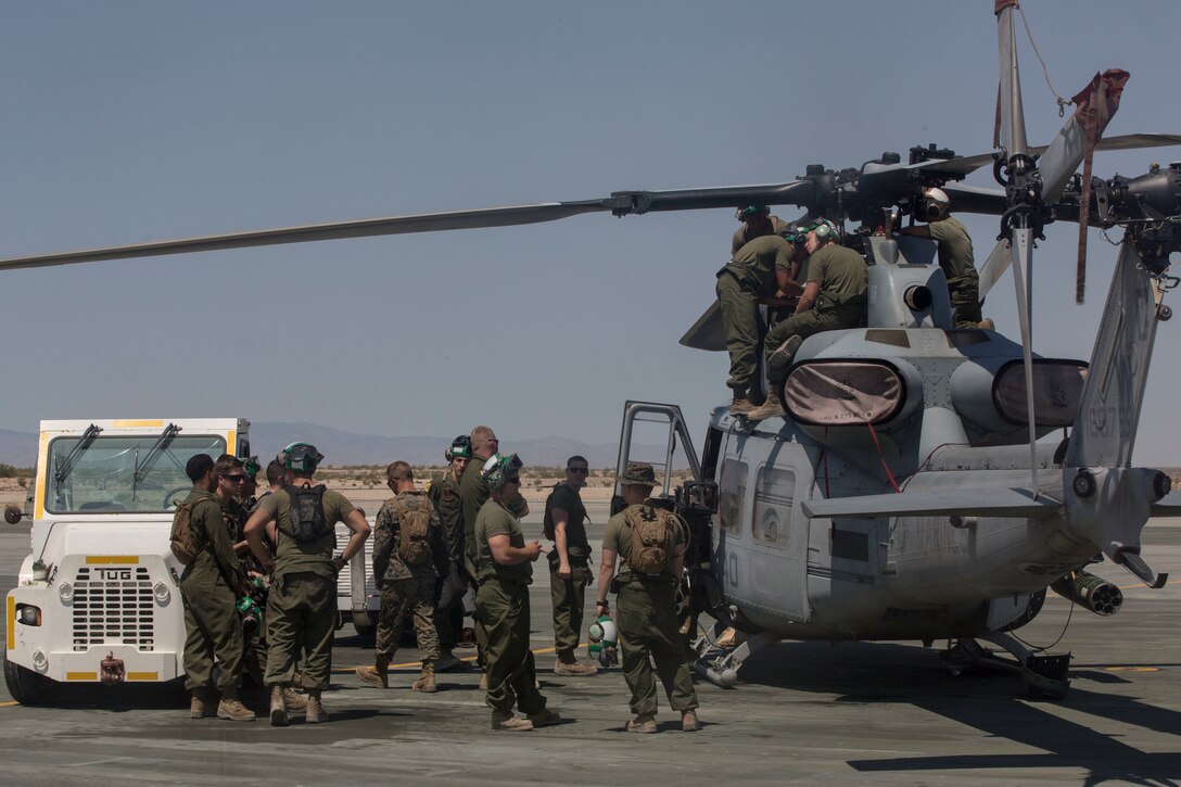 U.S. Marines with Marine Light Helicopter Squadron 773, Marine Aircraft Group 49, 4th Marine Aircraft Wing, Marine Forces Reserve, conduct maintenance on an AH-1Z Cobra belonging to HMLA-733 on an airstrip at Camp Wilson, Marine Air Ground Combat Center Twentynine Palms, California, June 21, 2017. The squdron prepared for night missions in support of the 2nd Battalion, 25th Marine Regiment, 4th Marine Division, MARFORRES, final battalion exercise of Integrated Training Exercise 4-17. (U.S. Marine Corps photo by Imari J. Dubose)