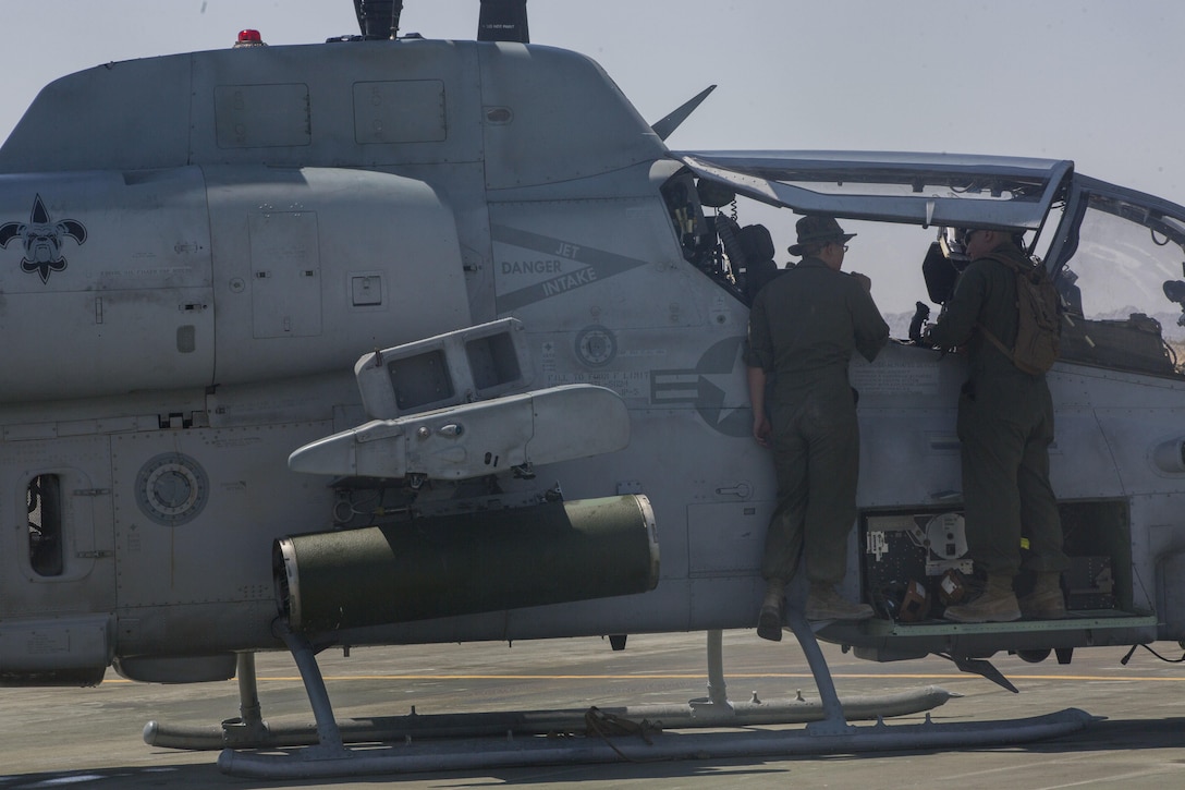 U.S. Marines with Marine Light Helicopter Squadron 773, Marine Aircraft Group 49, 4th Marine Aircraft Wing, Marine Forces Reserve, conduct maintenance on an AH-1Z Cobra belonging to HMLA-733 on an airstrip at Marine Air Ground Combat Center Twentynine Palms, California, June 21, 2017. The squadron prepared for night missions in support of the 2nd Battalion, 25th Marine Regiment, 4th Marine Division, MARFORRES, final battalion exercise of Integrated Training Exercise 4-17. (U.S. Marine Corps photo by Imari J. Dubose)