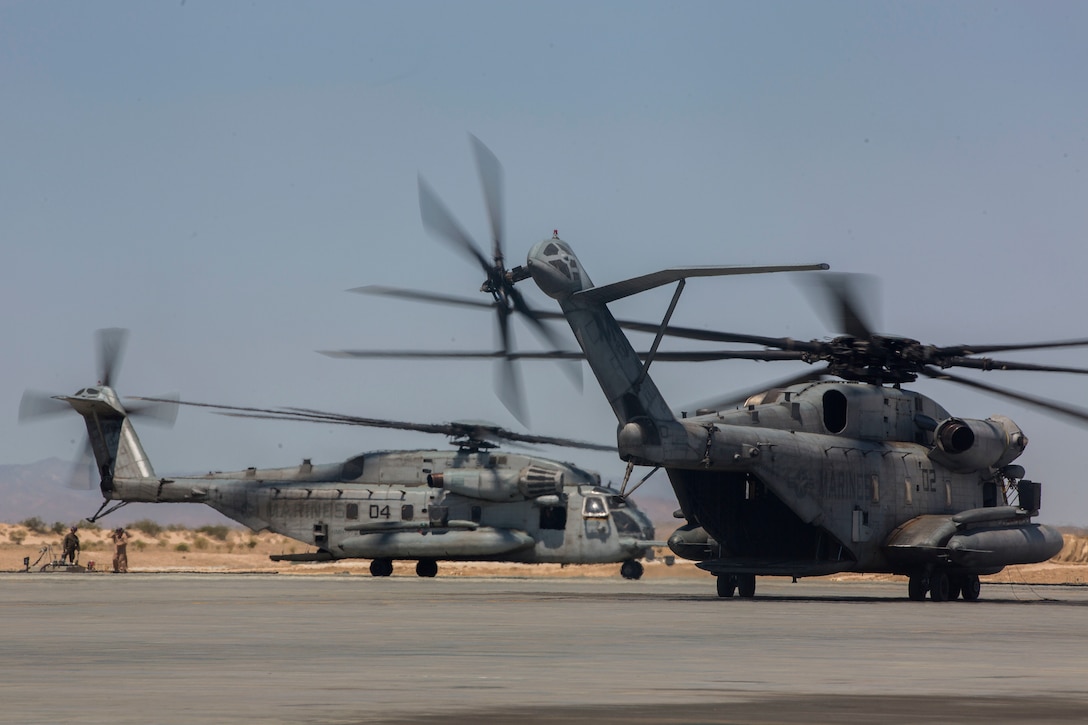 Two CH-53E Super Stallions, belonging to Marine Heavy Helicopter Squadron 772, Marine Aircraft Group 49, 4th Marine Aircraft Wing, Marine Forces Reserve, prepare to take off from an airstrip at Camp Wilson, Marine Air Ground Combat Center Twentynine Palms, California, June 21, 2017. The squadron prepared for night missions in support of the 2nd Battalion, 25th Marine Regiment, 4th Marine Division, MARFORRES, final battalion exercise of Integrated Training Exercise 4-17.  (U.S. Marine Corps photo by Imari J. Dubose)
