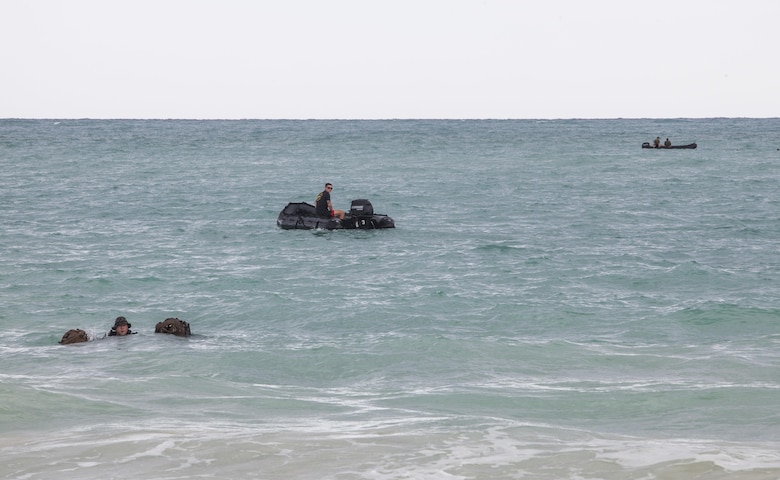 MARINE CORPS TRAINING AREA BELLOWS - Marines with Radio Reconnaissance Platoon, 3rd Radio Battalion conduct a two kilometer fin swim to shore during a Radio Reconnaissance Operator Course aboard Marine Corps Training Area Bellows, June 15, 2017. The swim is a small example of the amphibious training that goes into the 13-week Radio Reconnaissance Operator Course. (U.S. Marine Corps photo by Lance Cpl. Luke Kuennen)