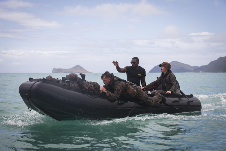 MARINE CORPS TRAINING AREA BELLOWS - Sgt. Antuan D. Martin, lead instructor of the Radio Reconnaissance Operator Course, instructs Marines on amphibious operations during an exercise aboard Marine Corps Training Area Bellows, June 15, 2017. Martin demonstrated how to safely launch and beach their zodiac inflatable craft with several surf passage exercises. (U.S. Marine Corps photo by Lance Cpl. Luke Kuennen)