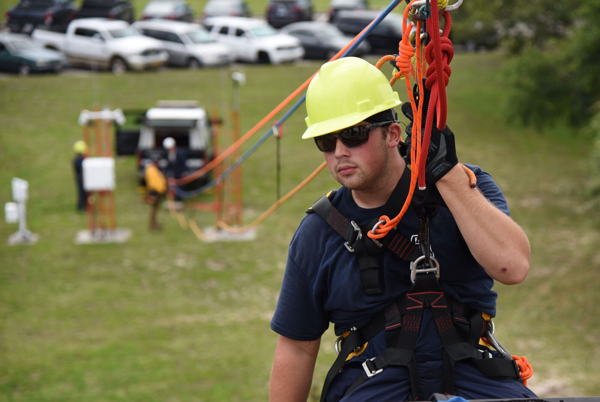 Taylor Beesley, Biloxi Firefighter, participates in a controlled descent exercise from atop of the Weather Training Complex during rope rescue operations training June 14, 2017, on Keesler Air Force Base, Miss. Keesler hosted the advanced rescue certification training course, which consisted of confined space rescue, high and low angle rescue and stokes basket rescue operations, for Keesler and Biloxi Firefighters. (U.S. Air Force photo by Kemberly Groue)