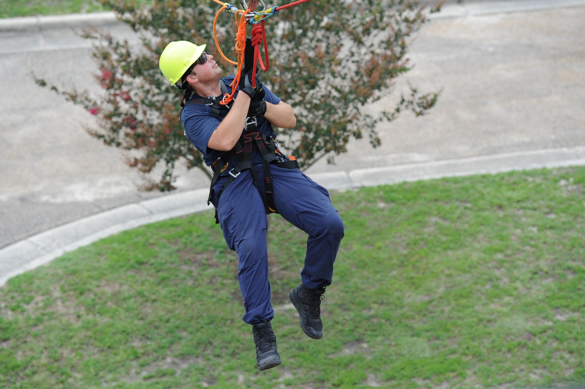 Taylor Beesley, Biloxi Firefighter, participates in a controlled descent exercise from atop of the Weather Training Complex during rope rescue operations training June 14, 2017, on Keesler Air Force Base, Miss. Keesler hosted the advanced rescue certification training course, which consisted of confined space rescue, high and low angle rescue and stokes basket rescue operations, for Keesler and Biloxi Firefighters. (U.S. Air Force photo by Kemberly Groue)