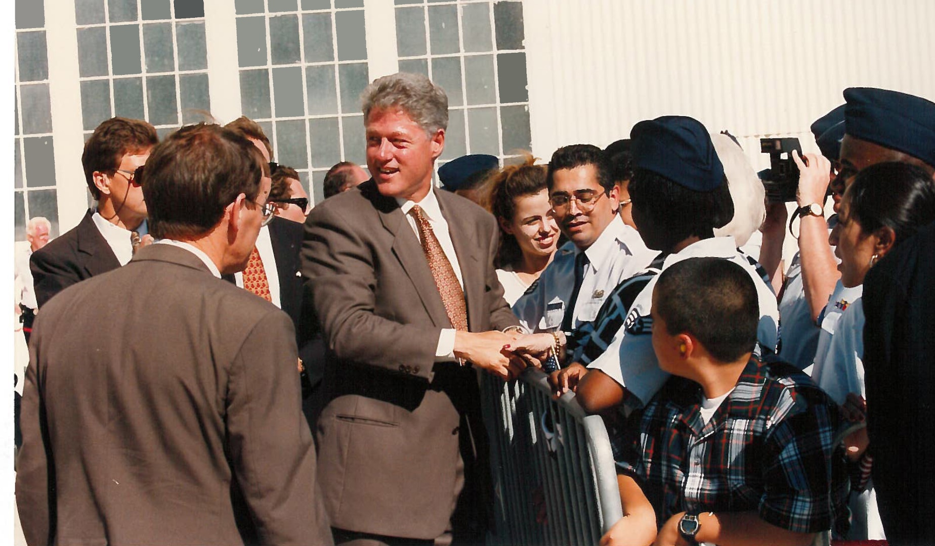 President Bill Clinton is greeted by onlookers after arriving at then-Kelly Air Force Base, San Antonio, Texas Oct. 17, 1995.