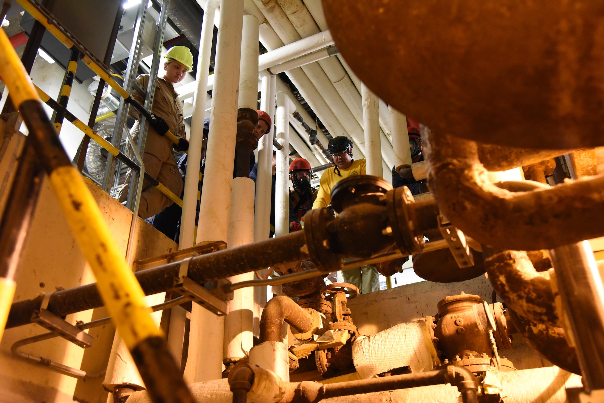 Members of the Keesler and Biloxi Fire Departments participate in confined space rescue operations training in the Keesler Medical Center June 16, 2017, on Keesler Air Force Base, Miss. Keesler hosted the advanced rescue certification training course, which consisted of confined space rescue, high and low angle rescue and stokes basket rescue operations. (U.S. Air Force photo by Kemberly Groue)