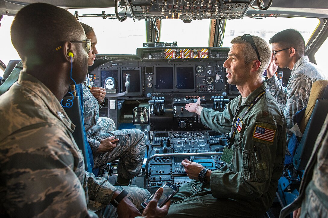 Maj. Matthew Menendez, a 68th Airlift Squadron pilot, gives a tour of the flight deck on a C-5M Super Galaxy aircraft June 21, 2017 at Joint Base San Antonio-Lackland, Texas. The third-year cadets are visiting operational units throughout the U.S.to get a better understanding of the different careers  available in the Air Force. (U.S. Air Force photo by Benjamin Faske)