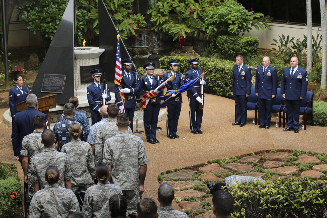 Honor Guard members post the colors during a Purple Heart ceremony for Senior Master Sgt. Jason Ronsse, 17th Operational Weather operations superintendent, at Joint Base Pearl Harbor-Hickam, Hawaii on June 20, 2017. Ronsse was injured during a in-direct fire incident while deployed to Bagram Air Base, Afghanistan.