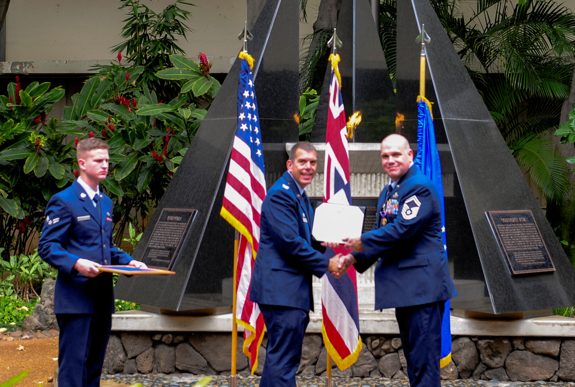 Col. Steven Dickerson, 557th Weather Wing commander, presents Senior Master Sgt. Jason L. Ronsse, 17th Operational Weather Squadron superintendent, with a Purple Heart Medal at the Hall of Heroes, on Joint Base Pearl Harbor-Hickam, Hawaii, June 20, 2017. Ronsse received numerous injuries in Dec. 2013 during his deployment in Bagram, Afghanistan in support of Operation Enduring Freedom. (U.S. Air Force photo by Airman 1st Class Jacoya Scandrick)