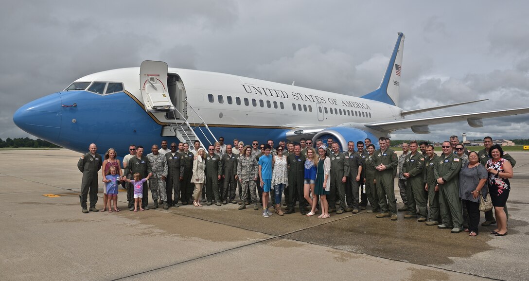 932nd Airlift Wing team members welcome Lt. Col. Robert Witzel (center with family) back from his final United States Air Force Reserve Command flight on 22 June 2017, at 1500 hours, on the Scott Air Force Base flight line.  A light rainstorm let up just about the time he and other crew members landed.  He waved to the crowd and walked down the stairs from the wing's beautiful C-40 for the last time, and thanked everyone for coming out to his historical "fini flight".  (U.S. Air Force photo by Christopher Parr)