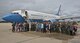 932nd Airlift Wing team members welcome Lt. Col. Robert Witzel (center with family) back from his final United States Air Force Reserve Command flight on 22 June 2017, at 1500 hours, on the Scott Air Force Base flight line.  A light rainstorm let up just about the time he and other crew members landed.  He waved to the crowd and walked down the stairs from the wing's beautiful C-40 for the last time, and thanked everyone for coming out to his historical 