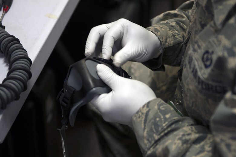 U.S. Air Force Technical Sgt. Warren Binyard, the 36th Fighter Squadron noncommissioned officer in charge of aircrew flight equipment, assembles parts of an oxygen mask June 21, 2017, at Eielson Air Force Base, Alaska. Binyard is stationed out of Osan Air Base, Republic of Korea but is TDY here for Red Flag-Alaska. (U.S. Air Force photo by Airman Eric M. Fisher)