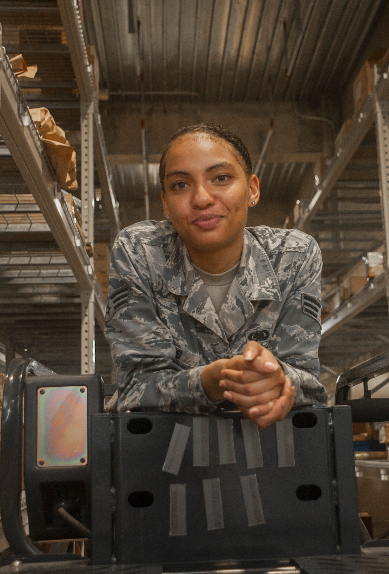 U.S. Air Force Senior Airman Serah Lewis, 18th Logistics Readiness Squadron material management specialist, stands for a photo June 22, 2017, at Kadena Air Base, Japan. The 18th LRS material management specialists ensure customers who visit the central warehouse are able to leave with the parts they need to complete their missions. (U.S. Air Force photo by Senior Airman Quay Drawdy)