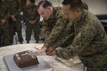 Chief Hospital Corpsman (Fleet Marine Force) Edgar E. Cuenca, right, a preventive medicine technician with Command Element, III Marine Expeditionary Force, and Hospital Corpsman (FMF) Joseph E. Clack, left, a corpsman assigned to 3rd Medical Battalion, 3rd Marine Logistics Group, III MEF, simultaneously cut a ceremonial cake during a celebration for the 119th birthday of the hospital corpsman rate at Camp Mujuk, Pohang, Republic of Korea, June 17, 2017. Marines from Bravo Company, 3rd Law Enforcement Battalion, III Marine Headquarters Group, III MEF and Corpsmen with 3rd Med Bn, 3rd MLG, III MEF came together to celebrate the birthday with a ceremonial cake cutting and birthday message reading from 3rd LE Bn senior enlisted advisor 1st Sgt. Derrick Benbow. (U.S. Marine Corps photo by Lance Cpl. Andy Martinez)