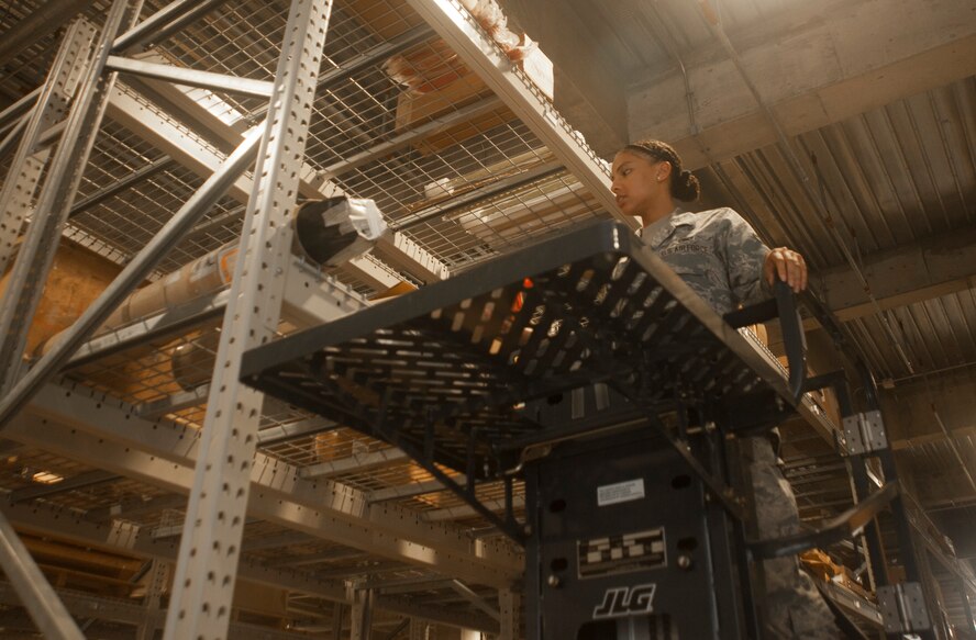 U.S. Air Force Senior Airman Serah Lewis, 18th Logistics Readiness Squadron material management specialist, searches for an item June 22, 2017, at Kadena Air Base, Japan. Airmen from the 18th LRS provide logistical support for every unit on Kadena and several more across Okinawa. (U.S. Air Force photo by Senior Airman Quay Drawdy)