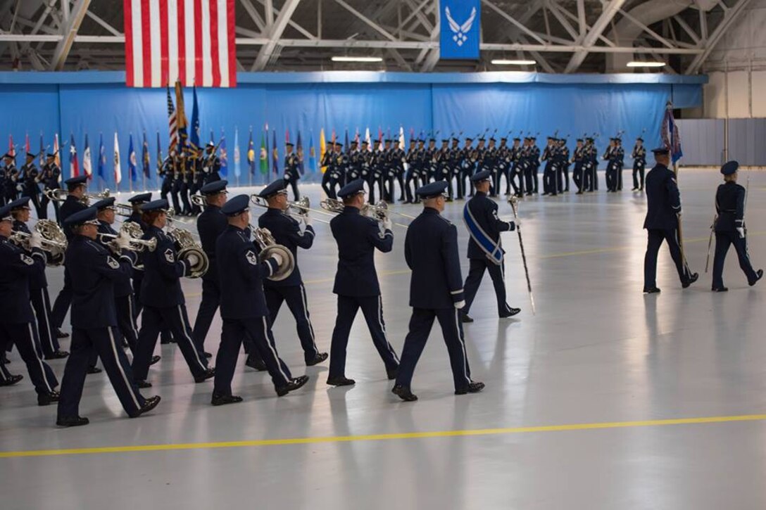 On June 20, ceremonial units pass in review as a part of a Change of Command Ceremony, held in historic Hangar 3 on Joint Base Andrews. This is a traditional part of the ceremony, to show respect for our Air Force District of Washington leadership.  (U.S. Air Force photos/TSgt Grant Langford/released)

