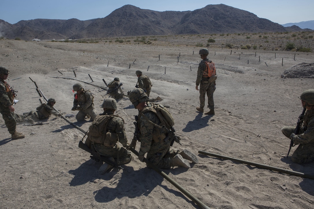 U.S. Marines with Golf Company, 2nd Battalion, 25th Marines, 4th Marine Division, Marine Forces Reserve, engineer a bangalore torpedo on range 400 as part of Integrated Training Exercise 4-17 at Camp Wilson, Twentynine Palms, California on June 18, 2017. ITX 4-17 is a live-fire and maneuver combined arms exercise designed to train battalion and squadron-sized units in the tactics, techniques, and procedures required to provide a sustainable and ready operational reserve for employment across the full spectrum of crisis and global engagement.