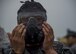 A Japan Air Self-Defense Force civil engineer Airman tries on a M50 gas mask during a bilateral exchange event at Misawa Air Base, Japan, June 21, 2017. Building friendships and enhancing mutual understanding were also a contributing factor in this Pacific unity event. After long days of training, U.S. and Japan CE Airmen removed their uniforms and hosted informal dinners to promote international partnerships. (U.S. Air Force photo by Senior Airman Deana Heitzman)