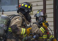 Firefighters assigned to the 35th Civil Engineer Squadron conducts a live-fire demonstration during a bilateral exchange event at Misawa Air Base, Japan, June 22, 2017. In addition to the live-fire demonstrations, CE Airmen from both countries learned about each other’s mission sets and watched rapid runway repair and emergency management exhibitions. (U.S. Air Force photo by Senior Airman Deana Heitzman)
