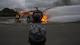 A Japan Air Self-Defense Force civil engineer Airman watches a live-fire demonstration during a bilateral exchange at Misawa Air Base, Japan, June 22, 2017. Building friendships and enhancing mutual understanding were also a contributing factor in this Pacific unity event. After long days of training, U.S. and Japan CE Airmen removed their uniforms and hosted informal dinners to promote international partnerships. (U.S. Air Force photo by Senior Airman Deana Heitzman)