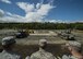 Airmen from the 35th Civil Engineer Squadron observe a Japan Air Self-Defense Force rapid runway repair exhibition during a bilateral exchange event at Misawa Air Base, Japan, June 22, 2017. This is phase one of a RRR, which fills in a crater or hole with gravel. The exchange focused on base recovery, which ensures infrastructure and airfields remain operational if a natural disaster or an attack occurs. (U.S. Air Force photo by Senior Airman Deana Heitzman)