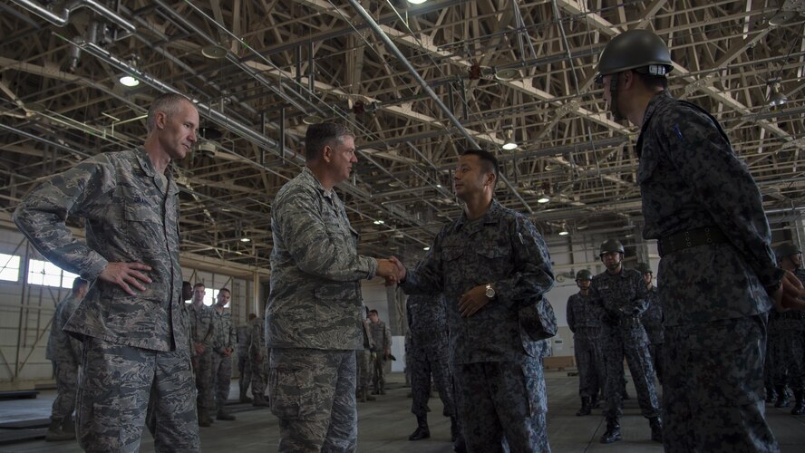 U.S. Air Force Col. Robert Grainger, left, 18th Civil Engineer Group commander at Kadena Air Base, Japan, and Col. Douglas Gilpin, left center, Fifth Air Force logistics, engineering and force protection director at Yokota Air Base, Japan, meets with Japan Air Self-Defense Force civil engineer leadership, right, during a bilateral exchange event at Misawa Air Base, Japan, June 22, 2017. Grainger and Gilpin joined JASDF leadership to share each other’s expertise and experiences with both the JASDF and U.S. Air Force junior Airmen. (U.S. Air Force photo by Senior Airman Deana Heitzman)