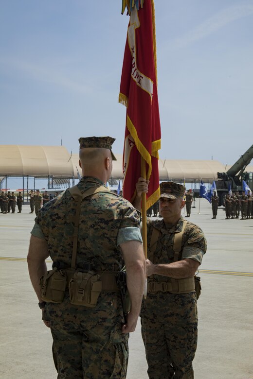 U.S. Marine Corps Col. Daniel Shipley, left, former Marine Aircraft Group (MAG) 12 commanding officer, waits for U.S. Marine Corps Sgt. Maj. Miguel A. Ortega, right, MAG-12 sergeant major, to pass the MAG-12 unit colors during a change of command ceremony at Marine Corps Air Station Iwakuni, Japan, June 23, 2017. After two years of dedicated service to MAG-12, Shipley was relieved of his duties to continue on and serve in Washington D.C. at Headquarters Marine Corps with Programs and Resources. (U.S. Marine Corps photo by Lance Cpl. Joseph Abrego)