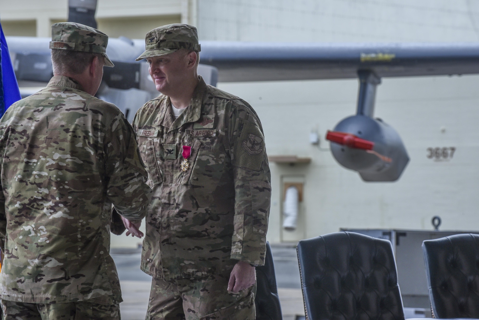 U.S. Air Force Lt. Gen. Brad Webb, commander of Air Force Special Operations Command, shakes hands with U.S. Air Force Col. William Freeman, outgoing commander of the 353rd Special Operations Group, and thanks Freeman for his leadership to the 353rd SOG during a change of command ceremony, June 19, 2017 at Kadena Air Base, Japan. Freeman leaves Kadena for an assignment at AFSOC Headquarters at Hurlburt Field, Fla. (U.S. Air Force photo by Senior Airman Nicholas Emerick)