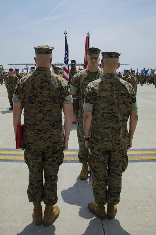 U.S. Marine Corps Col. Daniel Shipley, left, former Marine Aircraft Group (MAG) 12 commanding officer, awaits a Legion of Merit award during a change of command ceremony at Marine Corps Air Station Iwakuni, Japan, June 23, 2017. Shipley received the award for his outstanding achievements and service to MAG-12. (U.S. Marine Corps photo by Lance Cpl. Joseph Abrego)