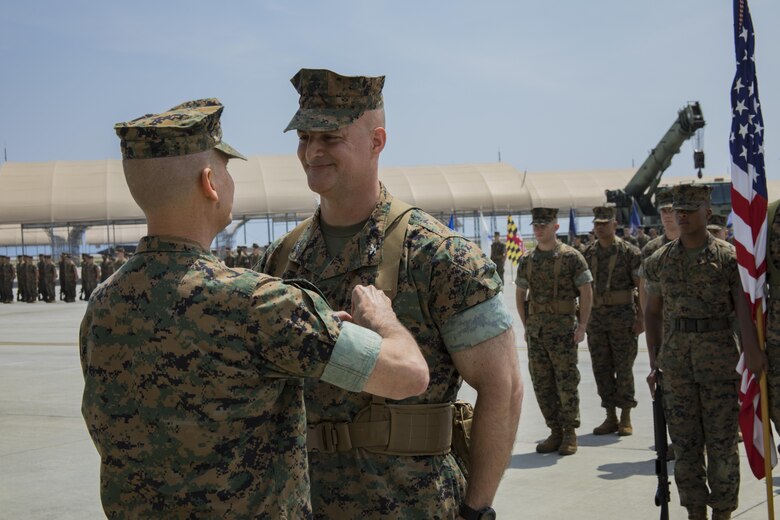 U.S. Marine Corps Maj. Gen. Russell A. Sanborn, left, the commanding general of 1st Marine Aircraft Wing, III Marine Expeditionary Force, places a Legion of Merit medal on U.S. Marine Corps Col. Daniel Shipley, right, former Marine Aircraft Group (MAG) 12 commanding officer, during a change of command ceremony at Marine Corps Air Station Iwakuni, Japan, June 23, 2017. Shipley was awarded the medal for his outstanding achievements and service to MAG-12. (U.S. Marine Corps photo by Lance Cpl. Joseph Abrego)