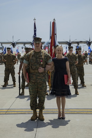 U.S. Marine Corps Col. Daniel Shipley, left, former Marine Aircraft Group (MAG) 12 commanding officer, and his wife Mrs. Kimberly Shipley, right, pose for a photo during a change of command ceremony at Marine Corps Air Station Iwakuni, Japan, June 23, 2017. After two years of dedicated service to MAG-12, Shipley was relieved of his duties to continue on and serve in Washington D.C. at Headquarters Marine Corps with Programs and Resources. (U.S. Marine Corps photo by Lance Cpl. Joseph Abrego)