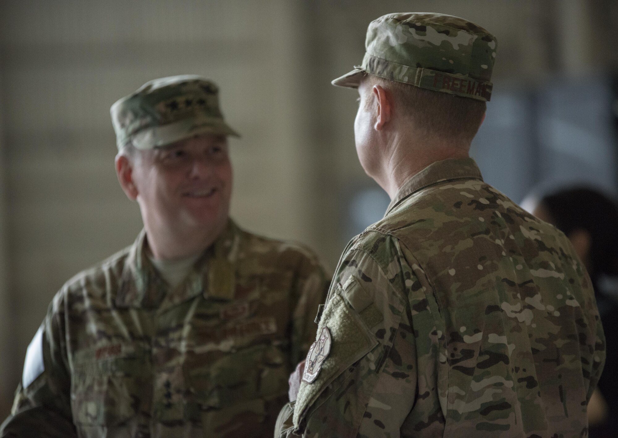 U.S. Air Force Lt. Gen. Brad Webb, commander of Air Force Special Operations Command and U.S. Air Force Col. William Freeman, outgoing commander of the 353rd Special Operations Group, exchange words prior to the change of command ceremony, June 19, 2017 at Kadena Air Base, Japan. Traveling to the Pacific, Webb presided over the ceremony and was accompanied by AFSOC Command Chief Master Sgt. Gregory Smith, who met with enlisted members during an all-call following the ceremony. (U.S. Air Force photo by Capt. Jessica Tait)