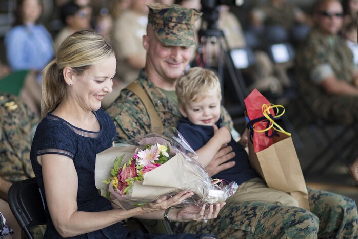 Mrs. Kimberly Shipley, wife of former Marine Aircraft Group (MAG) 12 commanding officer, reacts to receiving flowers during a change of command ceremony at Marine Corps Air Station Iwakuni, Japan, June 23, 2017. After two years of dedicated service to MAG-12, U.S. Marine Corps Col. Daniel Shipley was relieved of his duties to continue on and serve in Washington D.C. at Headquarters Marine Corps with Programs and Resources. (U.S. Marine Corps photo by Lance Cpl. Joseph Abrego)