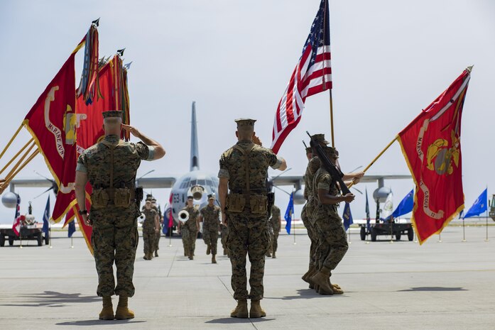 U.S. Marine Corps Col. Daniel Shipley, left, former Marine Aircraft Group (MAG) 12 commanding officer, and U.S. Marine Corps Col. Mark Palmer, right, MAG-12 commanding officer, pay their respects to colors during a change of command ceremony at Marine Corps Air Station Iwakuni, Japan, June 23, 2017. After two years of dedicated service to MAG-12, Shipley was relieved of his duties by Palmer. (U.S. Marine Corps photo by Lance Cpl. Joseph Abrego)