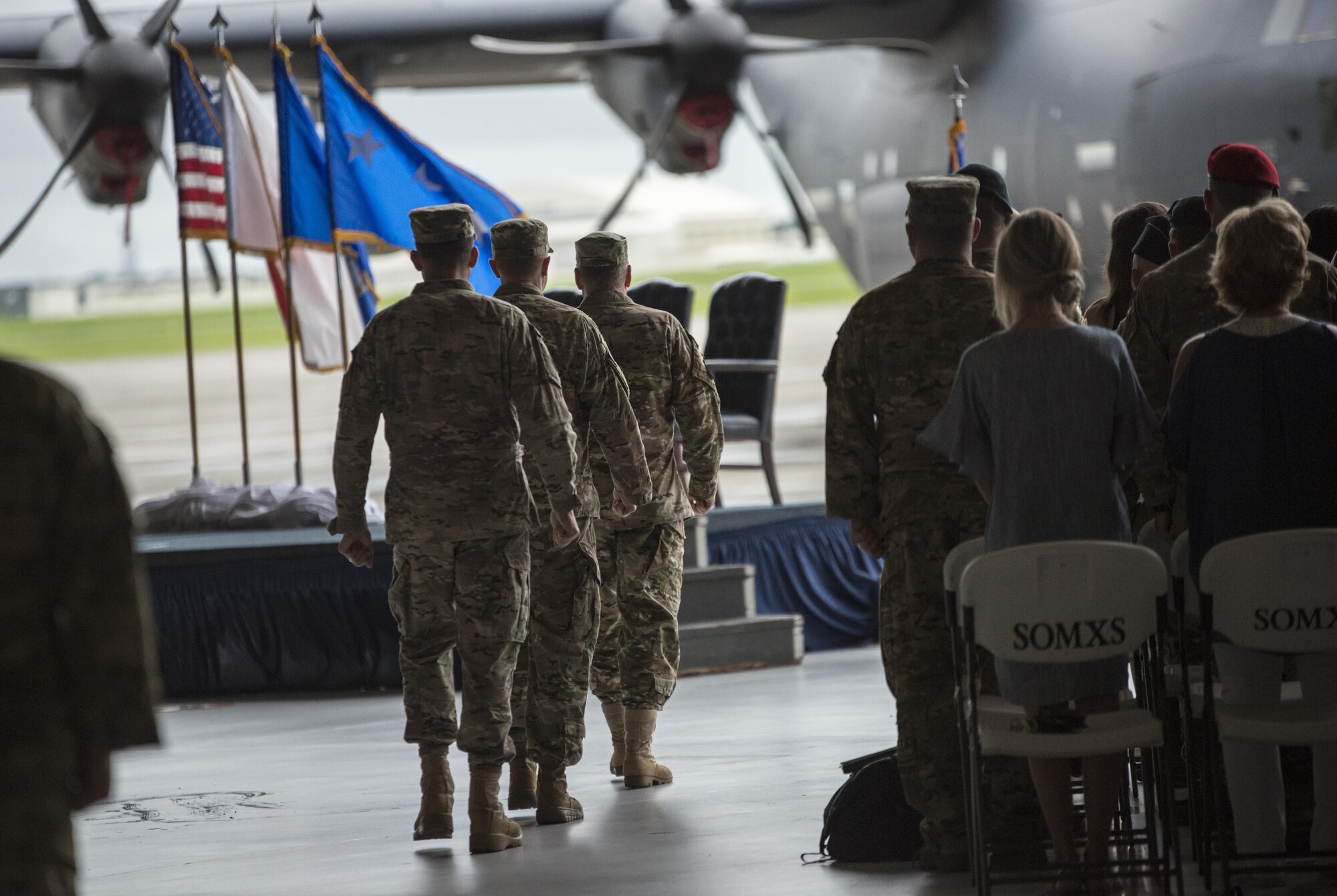 U.S. Air Force Lt. Gen. Brad Webb, commander of Air Force Special Operations Command, U.S. Air Force Col. William Freeman, outgoing commander of the 353rd Special Operations Group and U.S. Air Force Col. Jason Kirby, incoming commander of the 353rd SOG, enter as the official party for the change of command ceremony, June 19, 2017 at Kadena Air Base, Japan. The ceremony is a time-honored tradition in which one officer relinquishes command and passes it to another. (U.S. Air Force photo by Capt. Jessica Tait)
