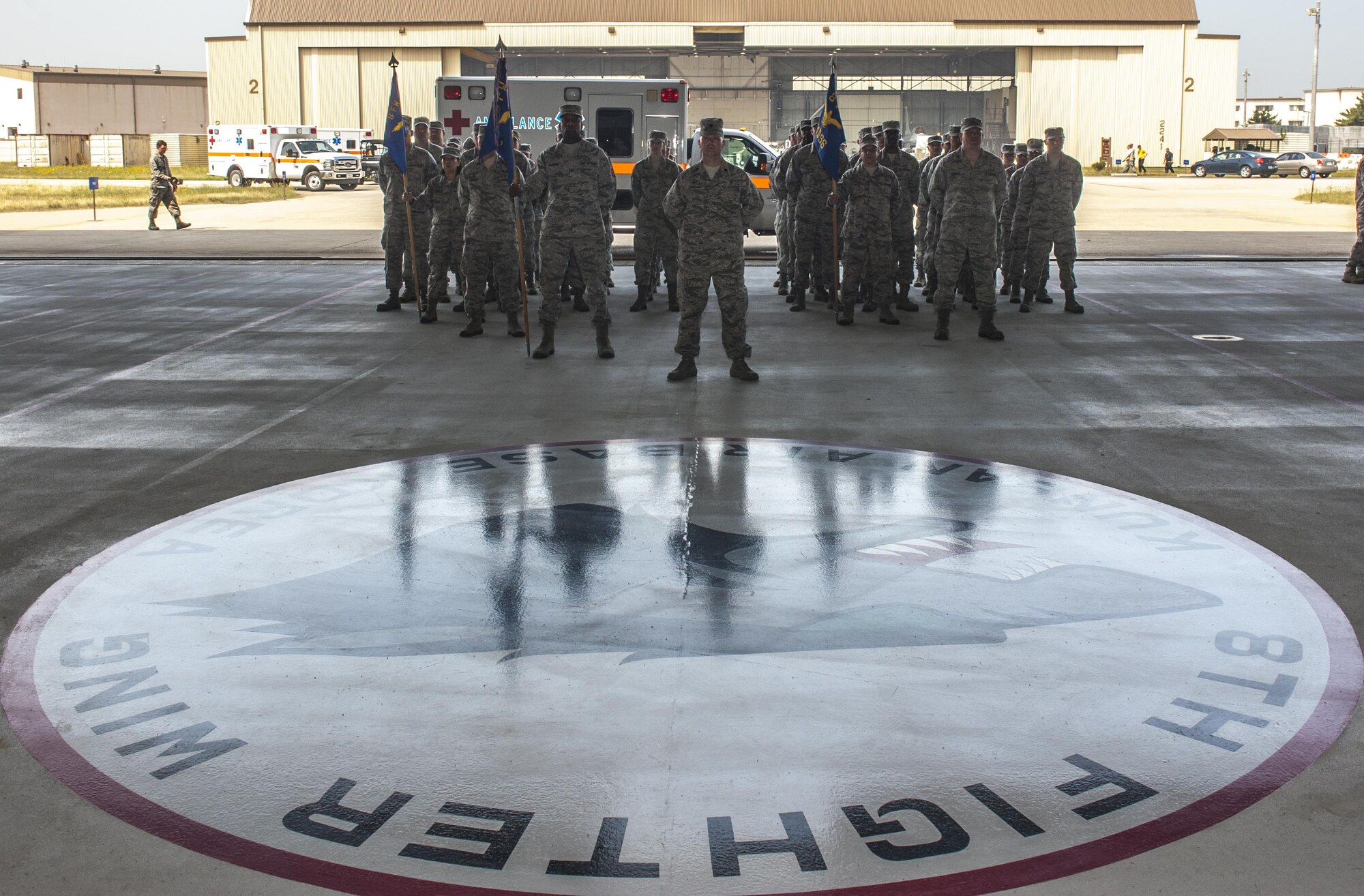 U.S. Airmen from the 8th Medical Group stand in formation during a change of command ceremony at Kunsan Air Base, Republic of Korea, June 23, 2017. Col. Joann V. Palmer took command of the 8th MDG from Col. Lisa A. Davison and upon assuming the position, received the title of “Hawk.” (U.S. Air Force photo by Senior Airman Colville McFee/Released)