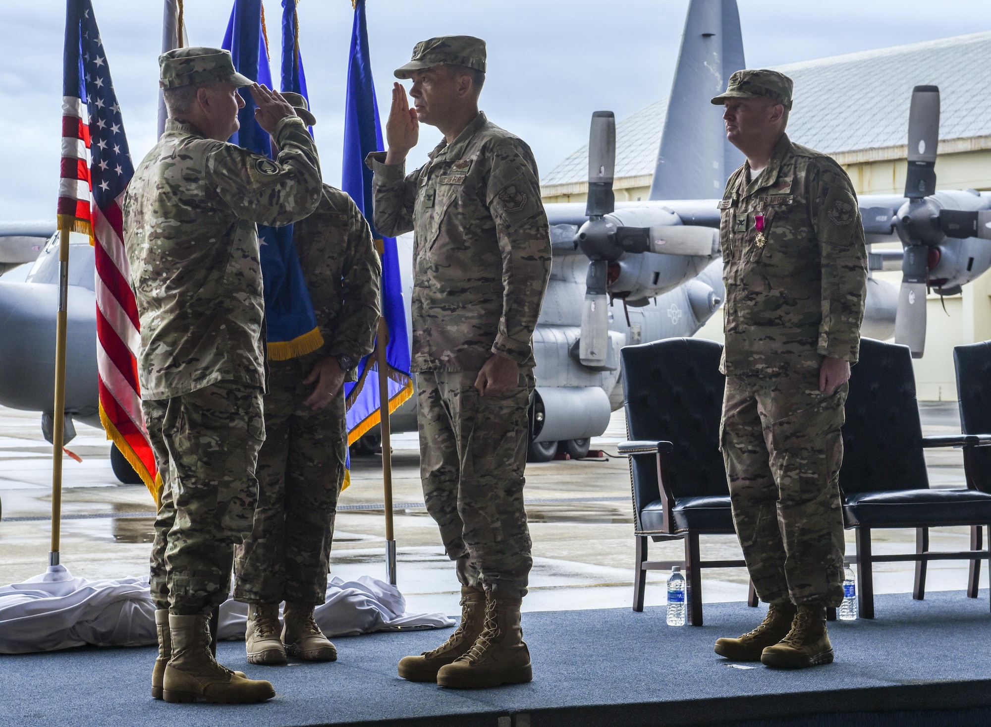 U.S. Air Force Lt. Gen. Brad Webb, commander of Air Force Special Operations Command, symbolically passes the guidon to U.S. Air Force Col. Jason Kirby, incoming commander of the 353rd Special Operations Group to signify the beginning of his command during a change of command ceremony, June 19, 2017 at Kadena Air Base, Japan. The ceremony is a time-honored tradition in which one officer relinquishes command and passes it to another. (U.S. Air Force photo by Senior Airman Nicholas Emerick)